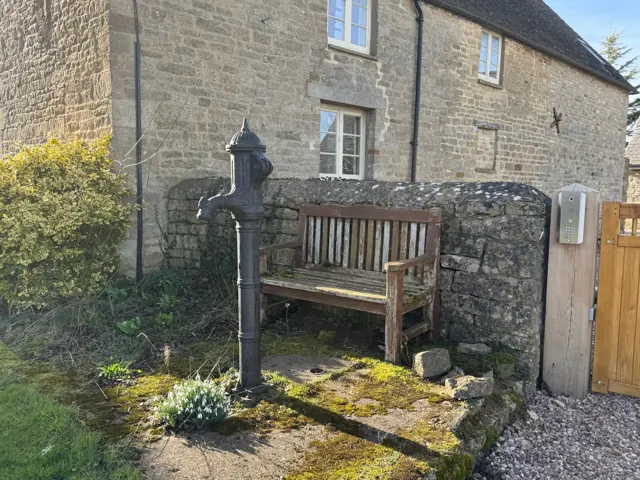 Gate and stone wall