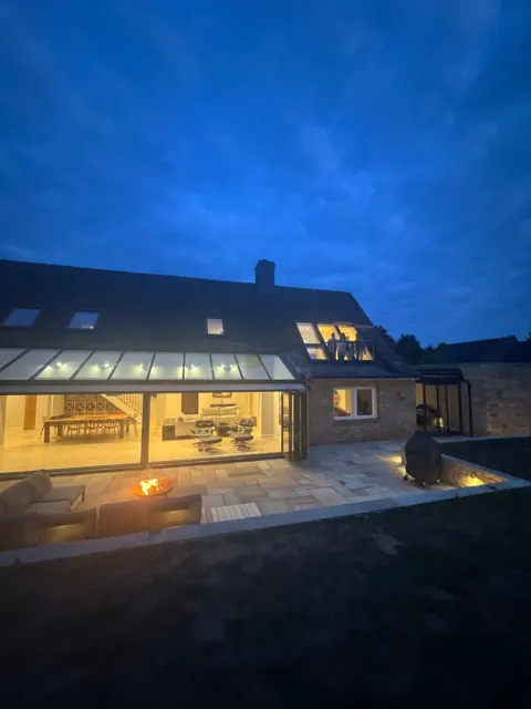 The house illuminated at dusk